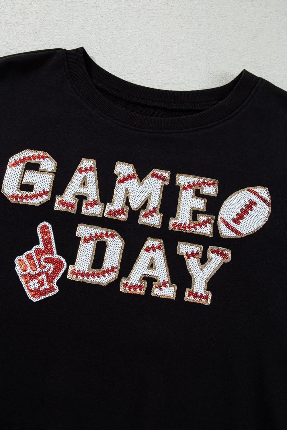 Black cropped rugby sweatshirt with tassels and sequins