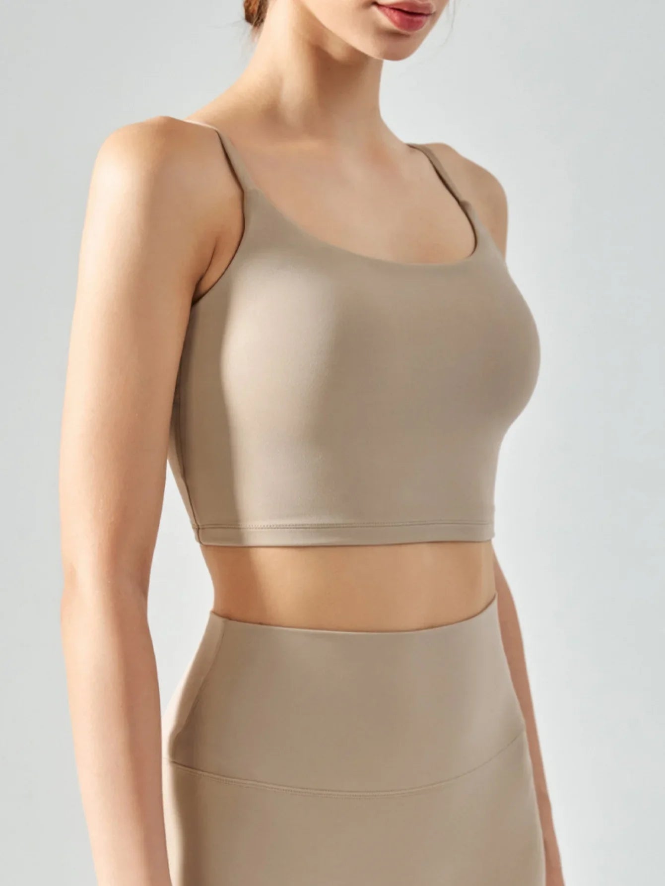 Women's sports bra with chest cushion, vest and suspender