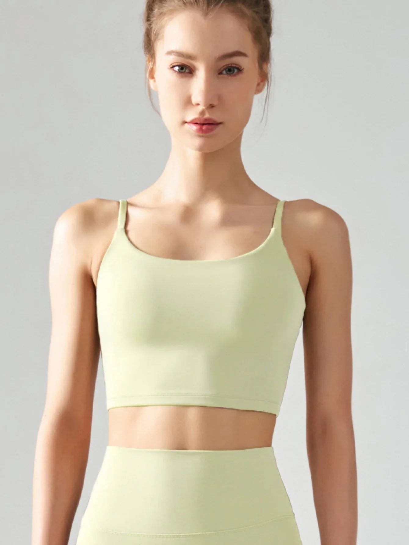 Women's sports bra with chest cushion, vest and suspender