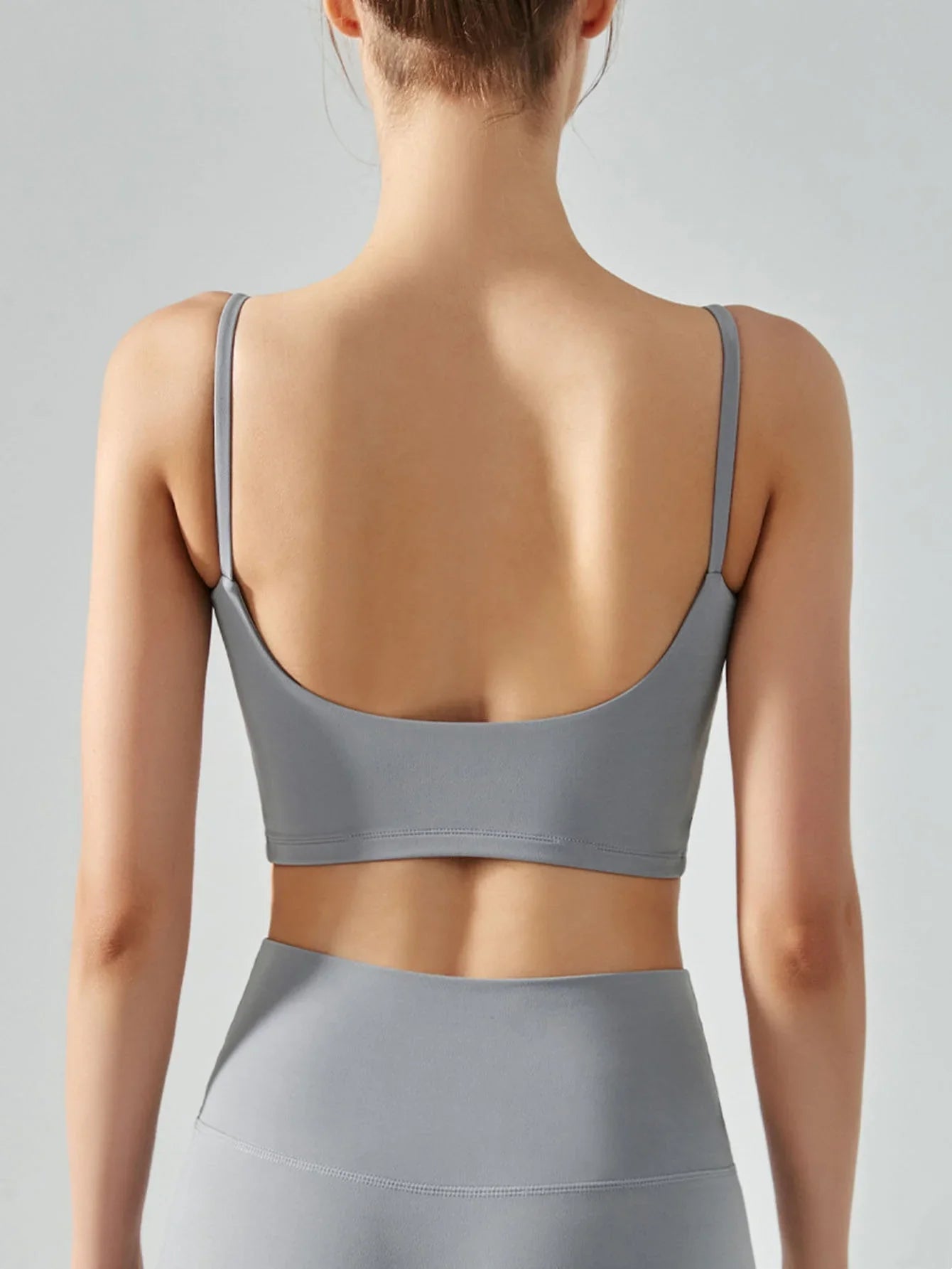 Women's sports bra with chest cushion, vest and suspender