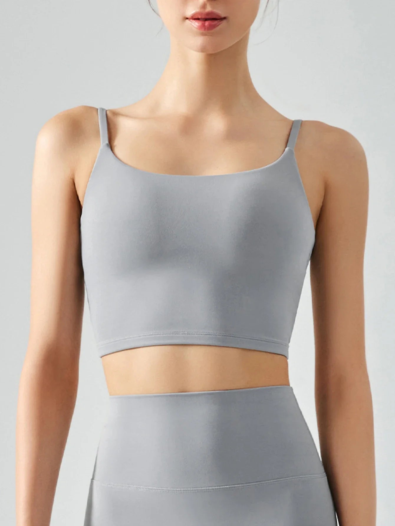 Women's sports bra with chest cushion, vest and suspender