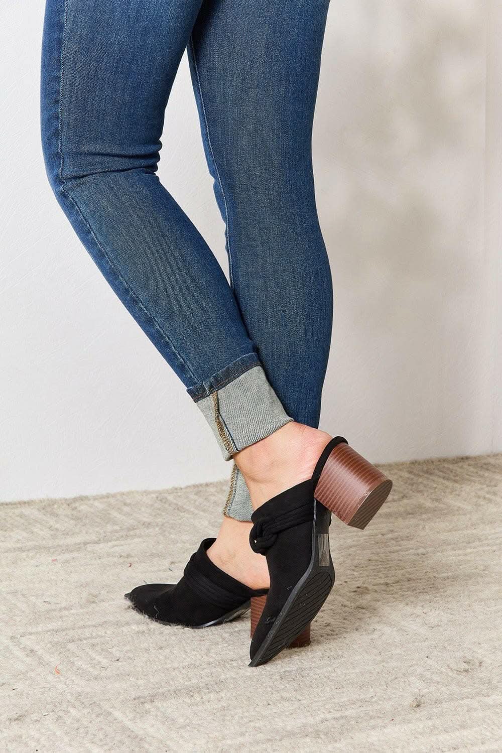 Sophisticated braided mid-heel mules