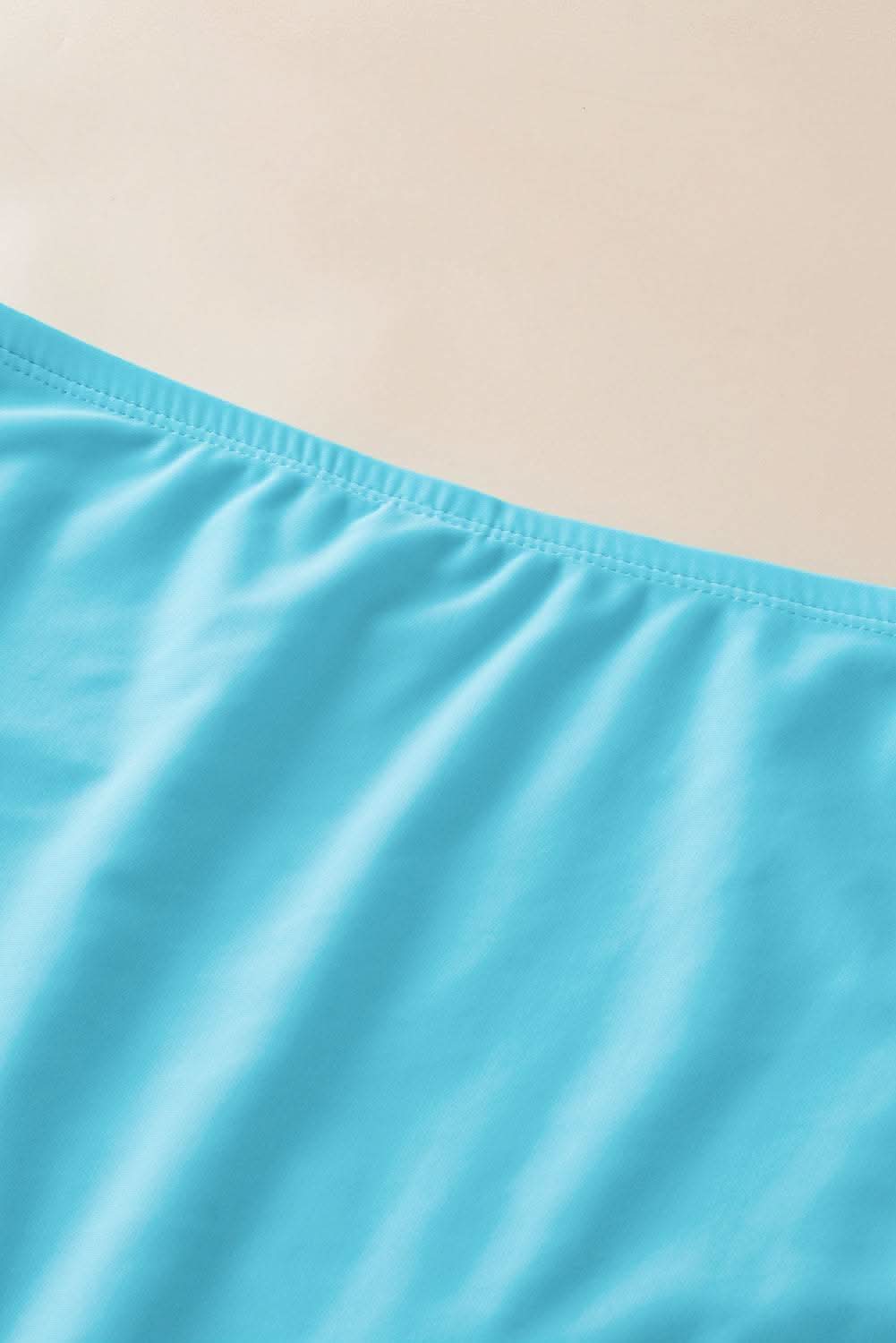 Turquoise mesh tankini with knot detail